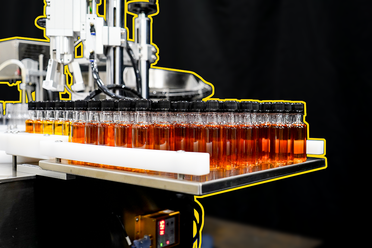 View of filled bottles on the Marksman Shooter Filler